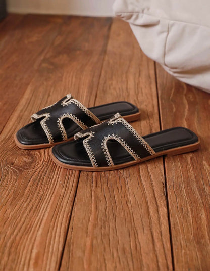 Mules plates femme bride en H noire